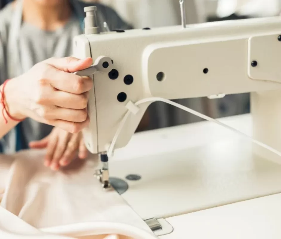 Woman working on a sewing machine