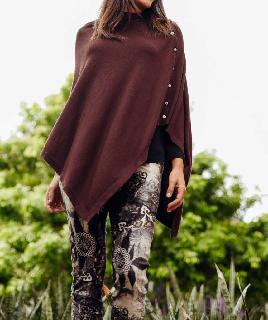 a woman wearing button poncho