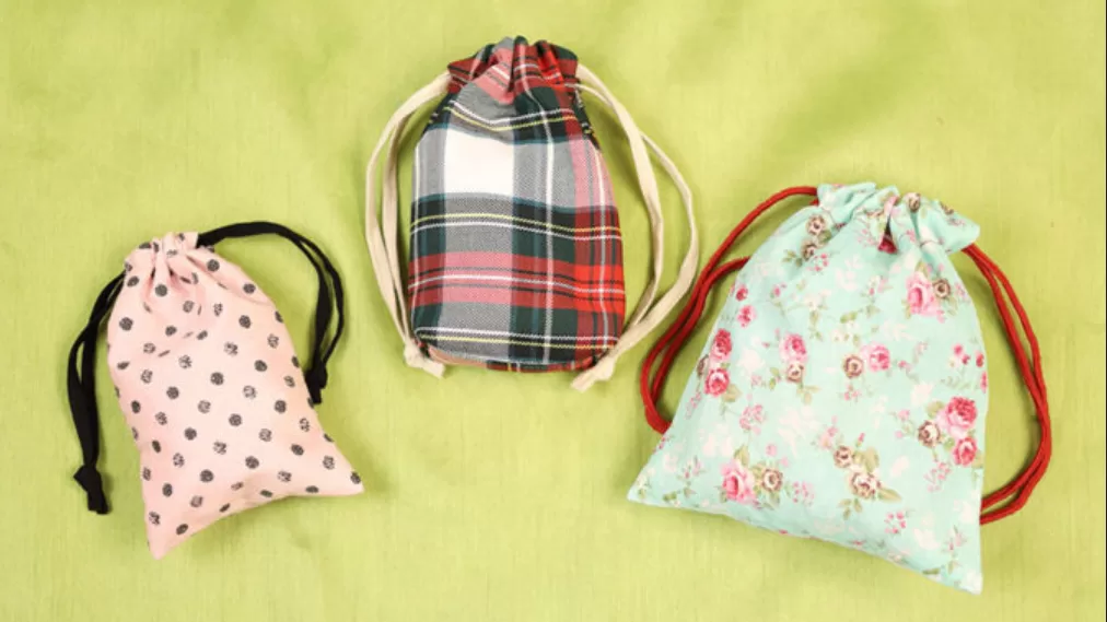 Examples of different design variations for reversible drawstring bags.